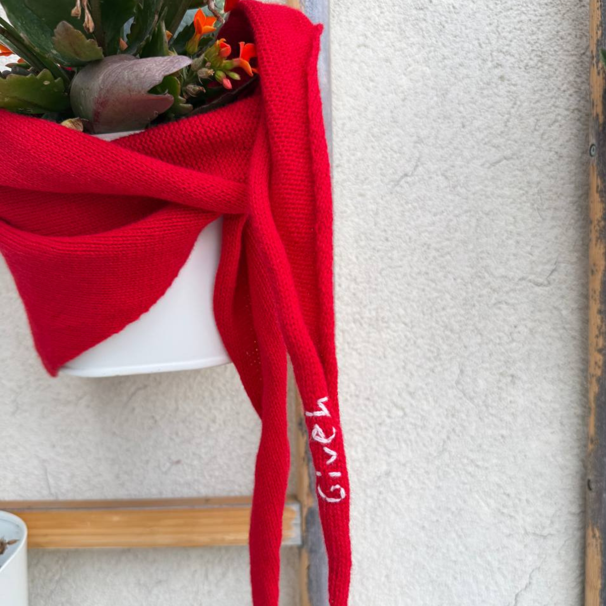Givéh handmade merino wool cashmere-blend mini scarf by female artisans in Iran, hand embroidered lily detail in red