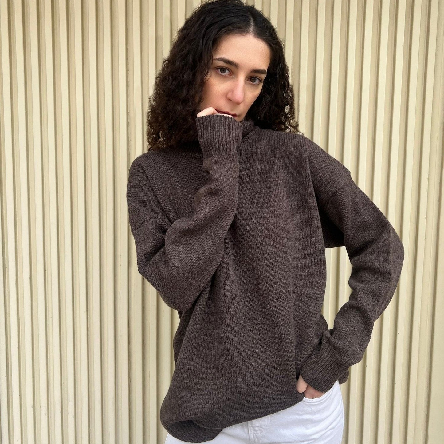 givéh knitwear handmade by female artisans in iran using only natural and recycled fibres. contemporary knitwear for cool people. turtleneck sweater in brown. 100% merino wool. fall 2025 collection.