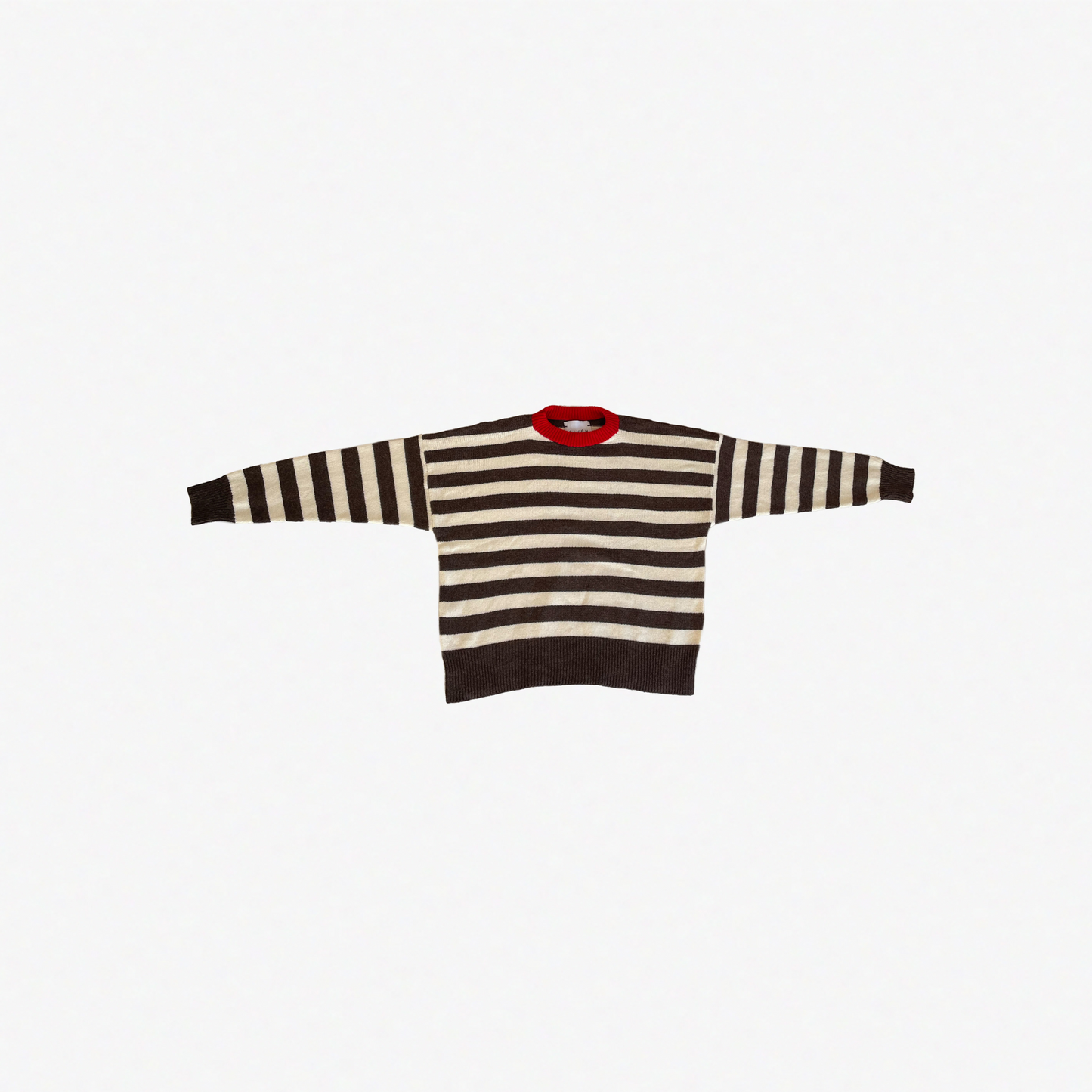 Striped sweater with a red collar on a white background.
givéh knitwear handmade by female artisans in iran using only natural and recycled fibres. contemporary knitwear for cool people. brown and cream striped unisex sweater with red crew neckline. 100% merino wool. fall 2025 collection.