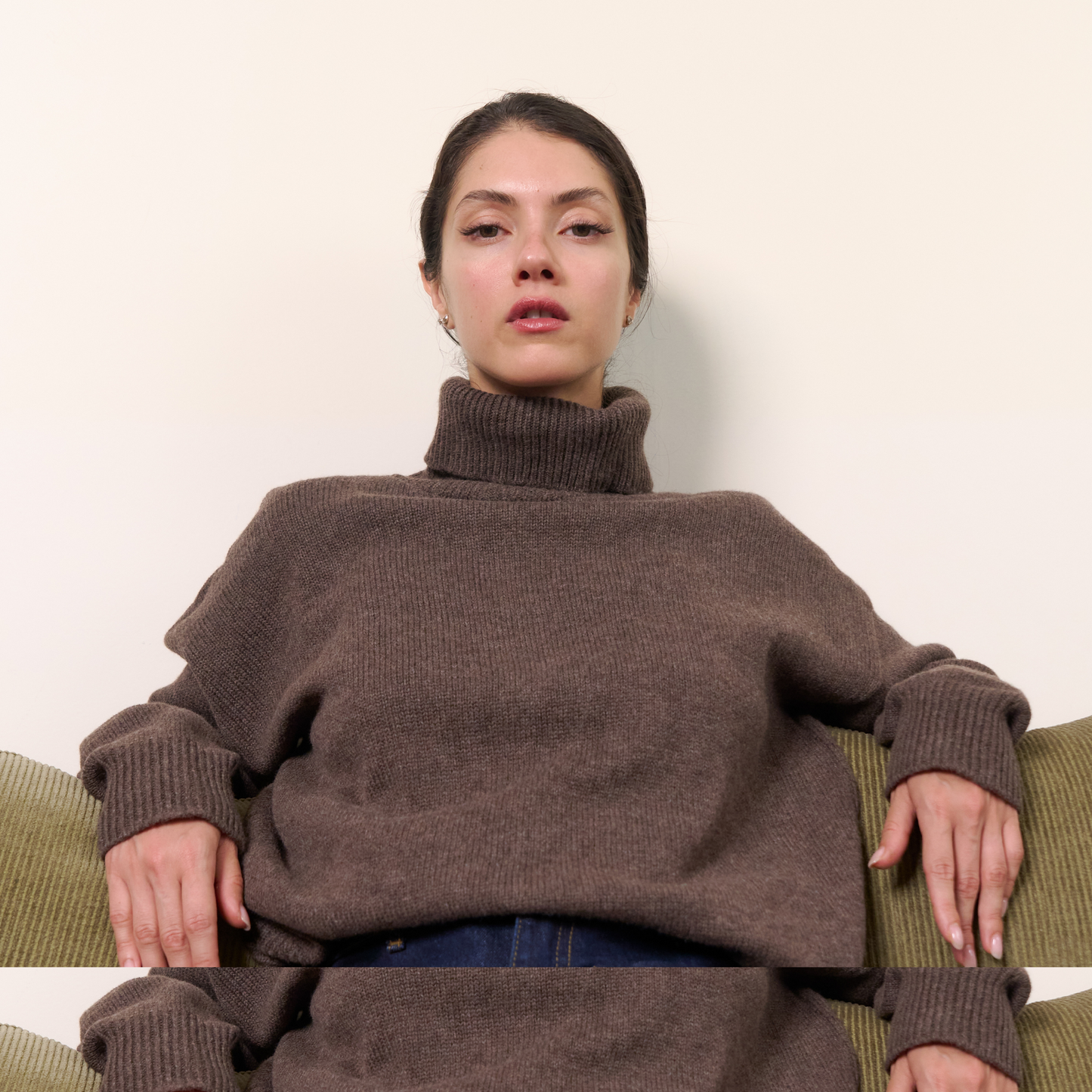 Woman wearing a large brown sweater sitting on a green couch against a white background.
givéh knitwear handmade by female artisans in iran using only natural and recycled fibres. contemporary knitwear for cool people. turtleneck sweater in brown. 100% merino wool. fall 2025 collection.