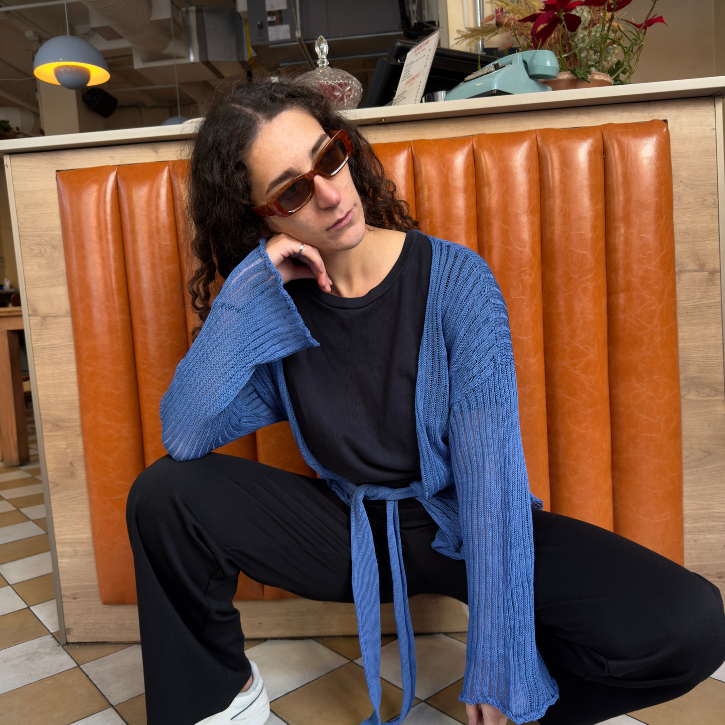 givéh knitwear handmade by female artisans in iran using only natural and recycled fibres. contemporary knitwear for cool people. darya cardi, blue knit cardigan with belt made of organic cotton yarn. spring summer 2025 collection.