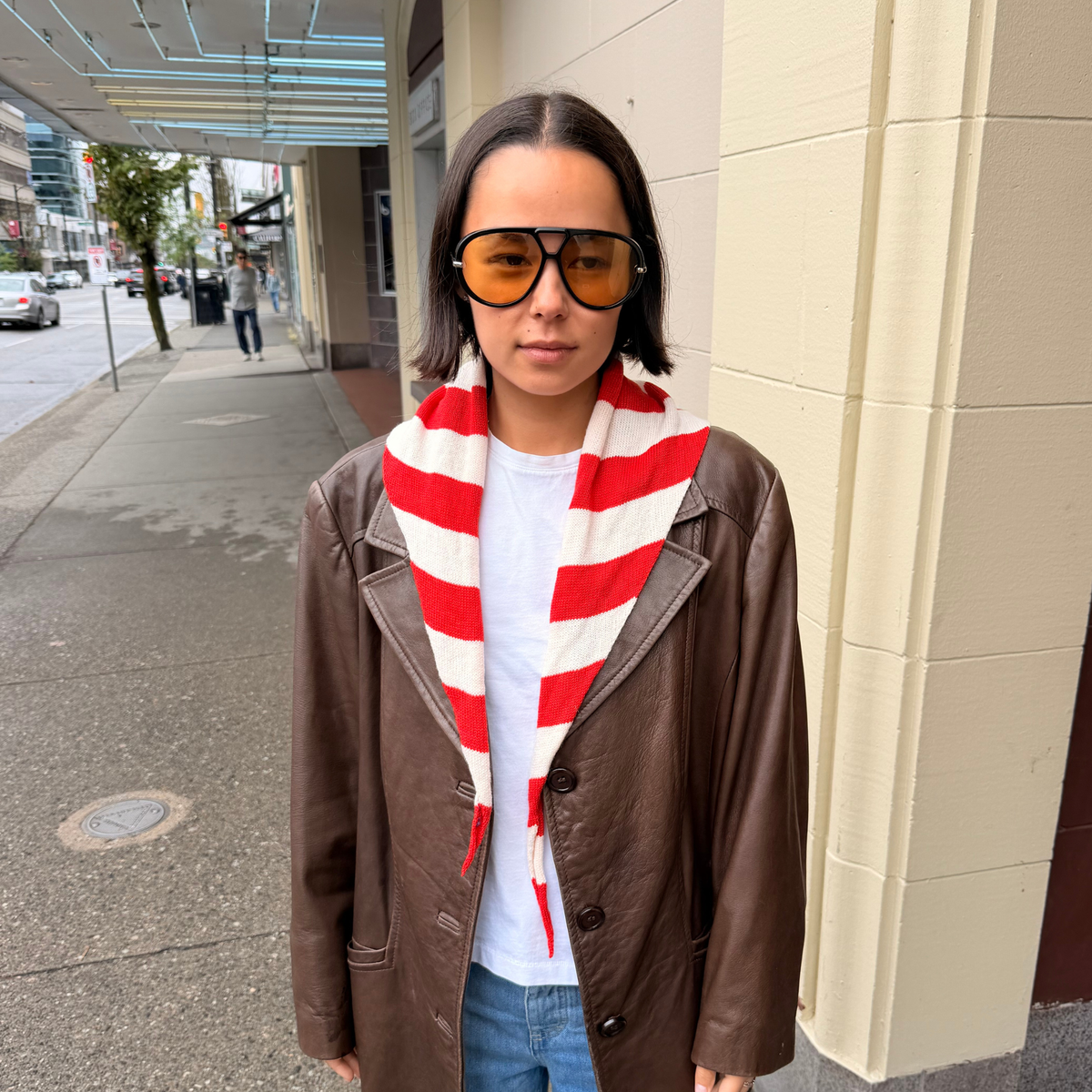 Givéh handmade merino wool cashmere-blend mini scarf by female artisans in Iran, hand embroidered lily detail in a red stripe