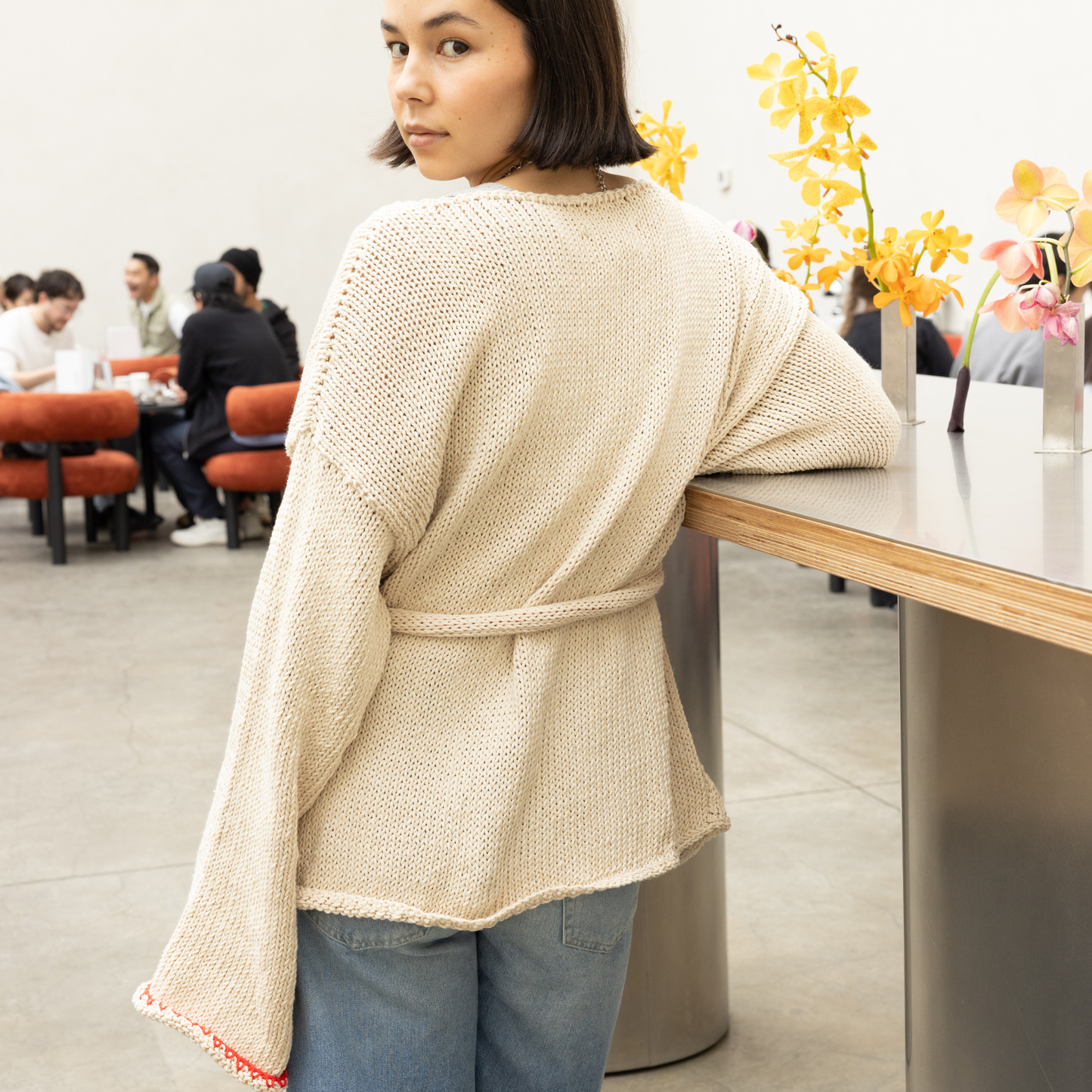 Givéh knitwear cotton hand knit cardigan by female artisans in Iran, belted wrap style with wide sleeves and open front, relaxed everyday layering piece