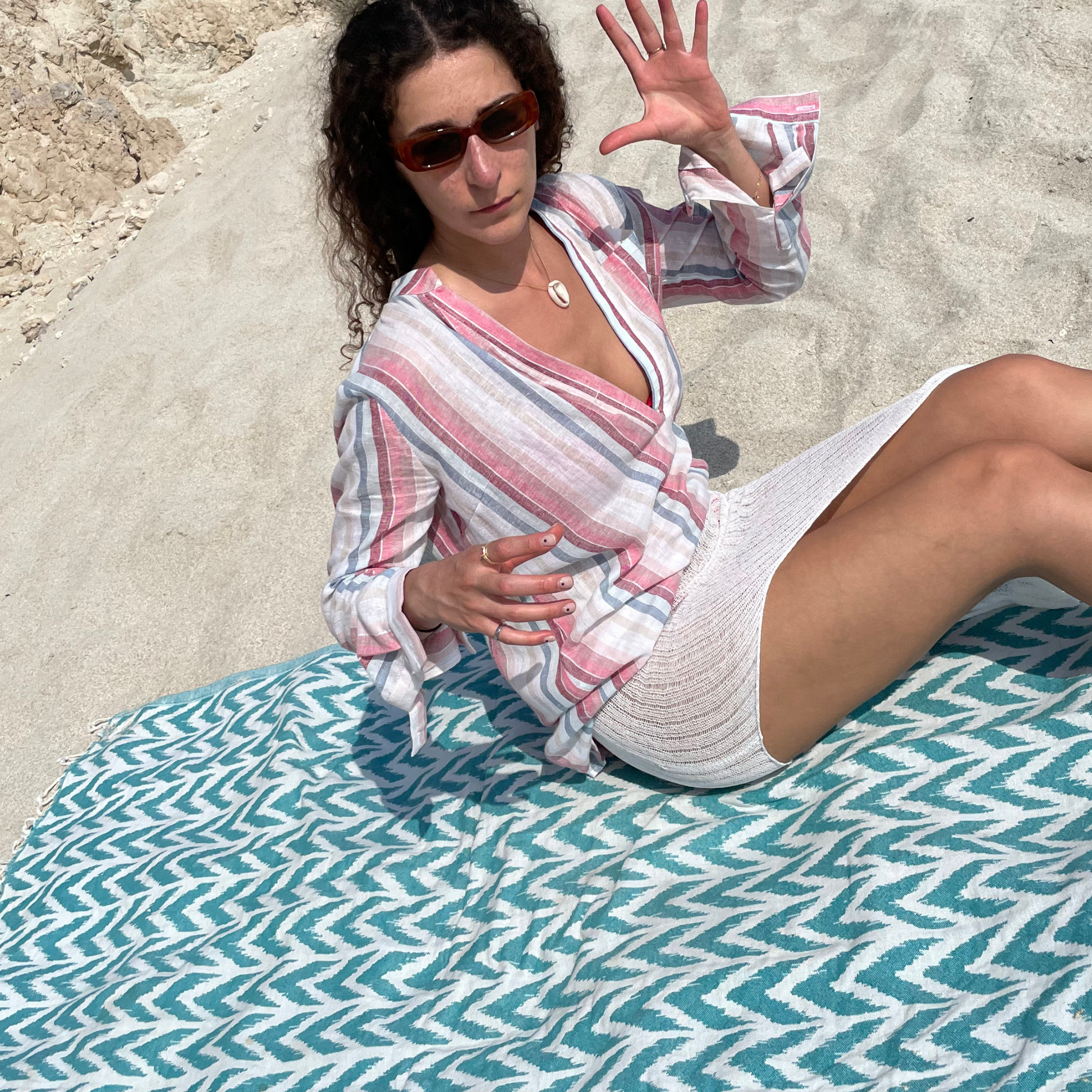 givéh knitwear handmade by female artisans in iran using only natural and recycled fibres. contemporary knitwear for cool people. white kaj skirt, asymmetrical organic cotton skirt. spring summer 2025 collection.