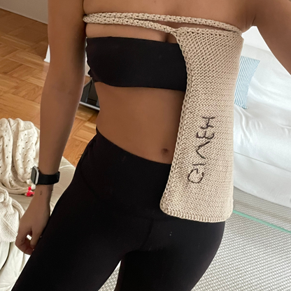 Givéh knitwear cotton hand crocheted crossbody bag by female artisans in Iran, adjustable strap, natural undyed cotton yarn. worn as a top.