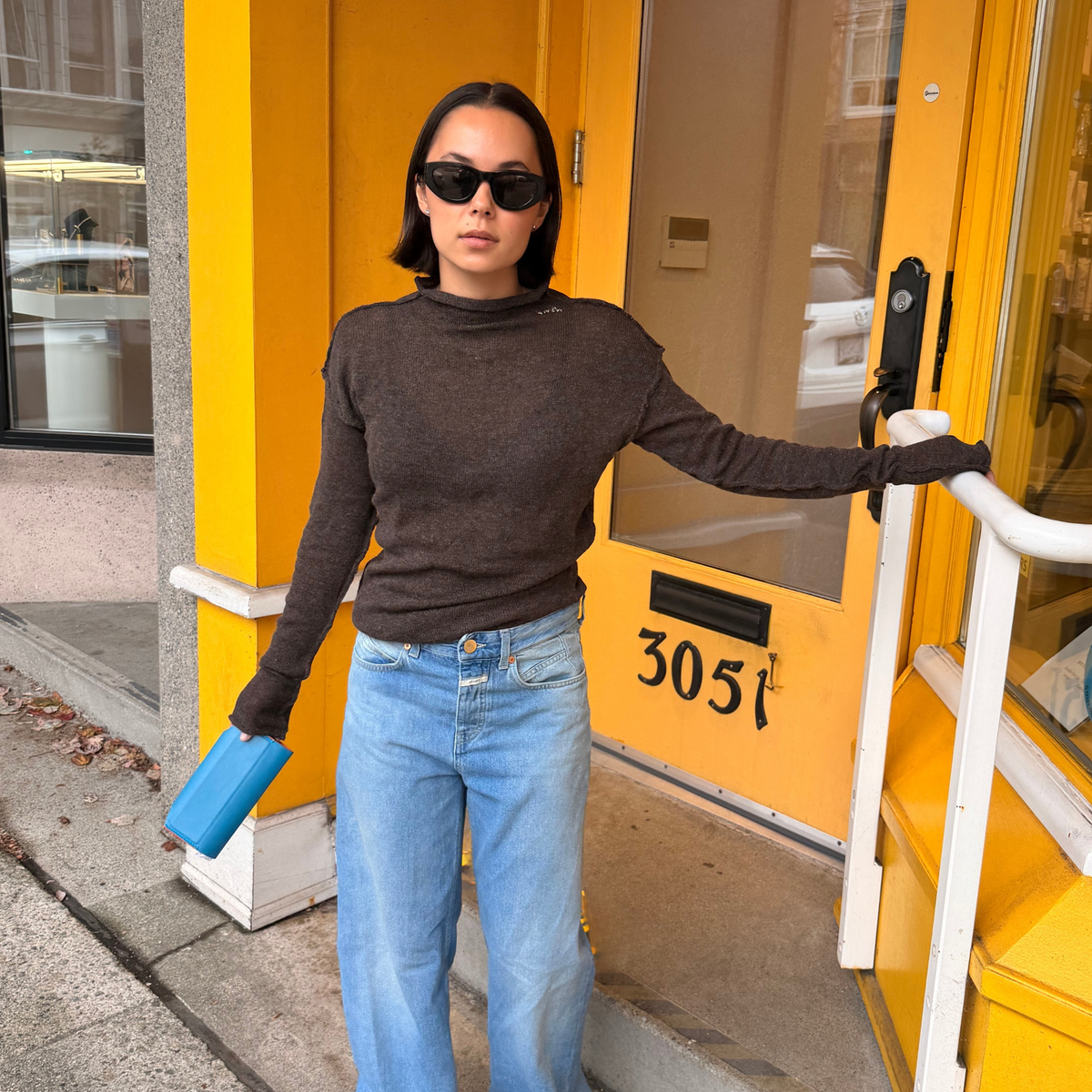 Givéh Panda mock-neck sweater in brown, a wool and cashmere knit by female artisans in Iran with an inside-out finish and embroidered Givéh lettering at the neckline
