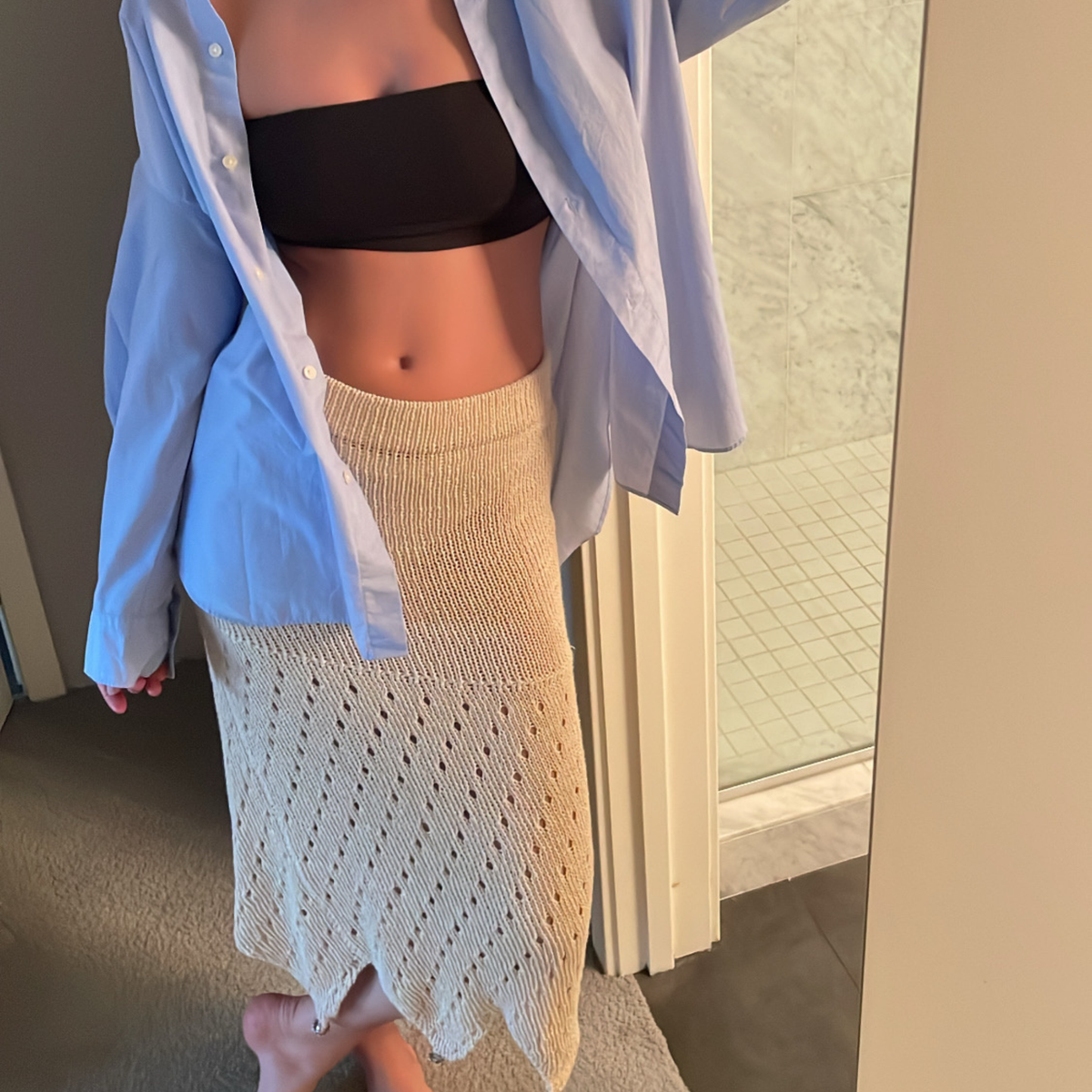 Givéh knitwear cotton hand crocheted skirt by female artisans in Iran, semi-sheer fitted silhouette with buttoned adjustable hem