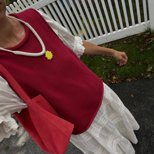 givéh knitwear handmade by female artisans in iran. aftab hand crocheted undyed cotton necklace with handmade clay ceramic pendant in the shape of the sun.