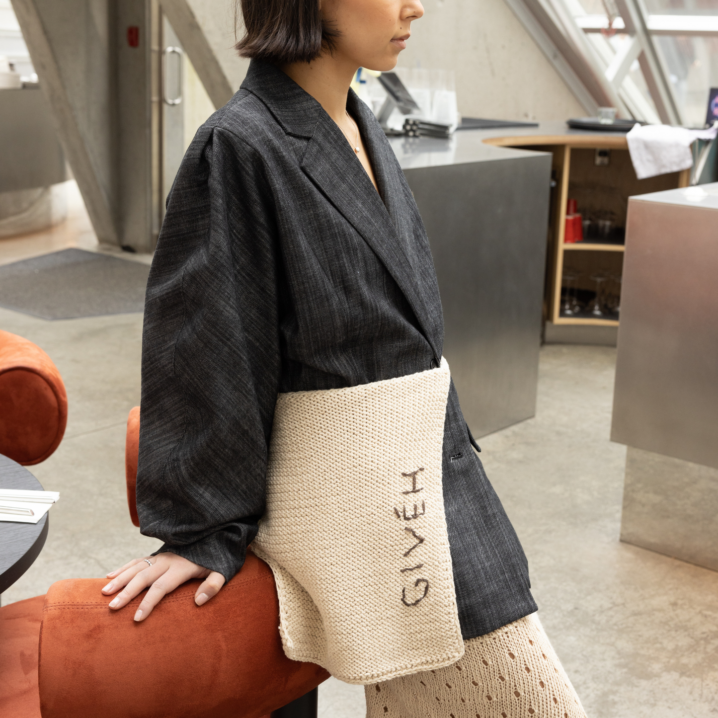 Givéh knitwear cotton hand crocheted crossbody bag by female artisans in Iran, adjustable strap, natural undyed cotton yarn. worn as a belt.