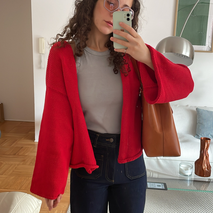 givéh knitwear handmade by female artisans in iran using only natural and recycled fibres. contemporary knitwear for cool people. chili the cardi, red knit cardigan with belt made of cotton and recycled polyamide yarn. spring summer 2025 collection.