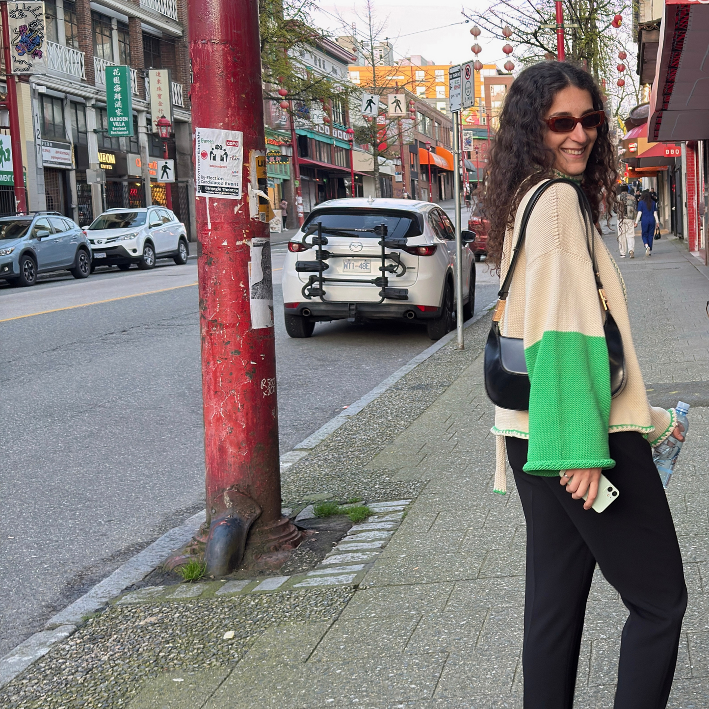 givéh knitwear handmade by female artisans in iran using only natural and recycled fibres. contemporary knitwear for cool people. cream the cardi, cream and green knit cardigan with belt made of cotton and recycled polyamide yarn. spring summer 2025 collection.
