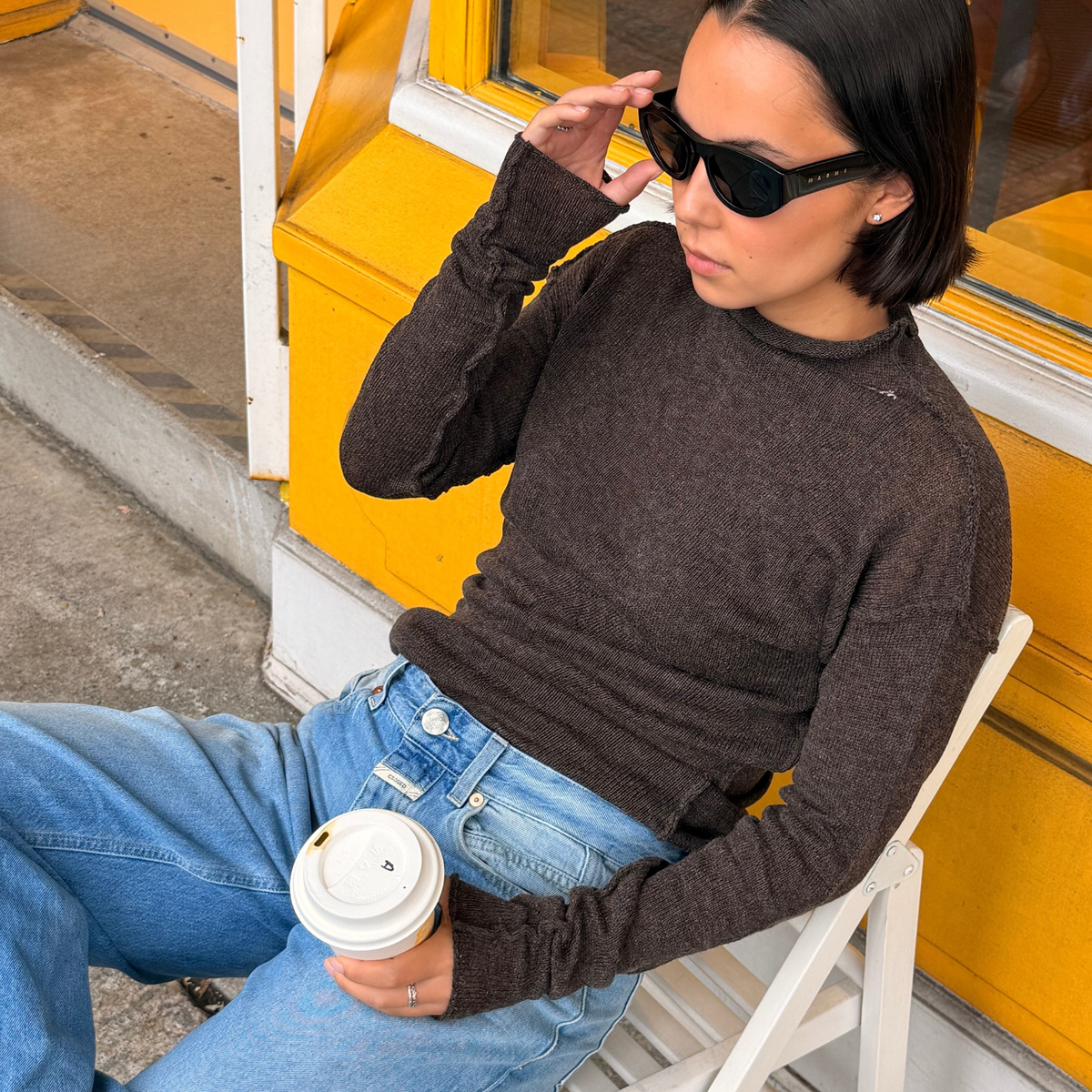 Givéh Panda mock-neck sweater in brown, a wool and cashmere knit by female artisans in Iran with an inside-out finish and embroidered Givéh lettering at the neckline