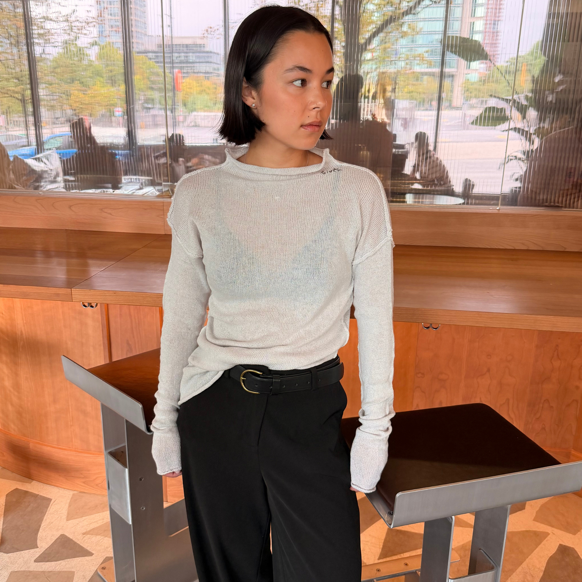Givéh Panda mock-neck sweater in ivory, a wool and cashmere knit by female artisans in Iran with an inside-out finish and embroidered Givéh lettering at the neckline