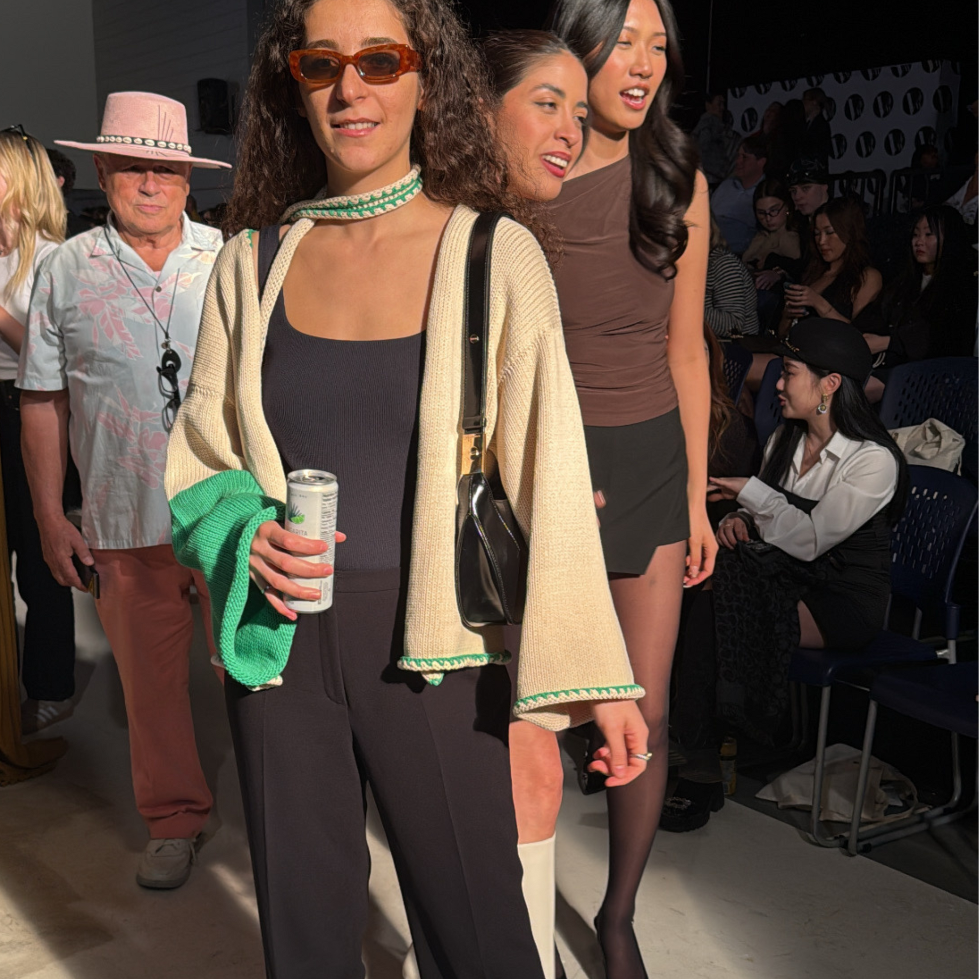 givéh knitwear handmade by female artisans in iran using only natural and recycled fibres. contemporary knitwear for cool people. cream the cardi, cream and green knit cardigan with belt made of cotton and recycled polyamide yarn. spring summer 2025 collection.