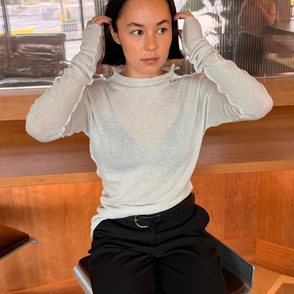 Givéh Panda mock-neck sweater in ivory, a wool and cashmere knit by female artisans in Iran with an inside-out finish and embroidered Givéh lettering at the neckline