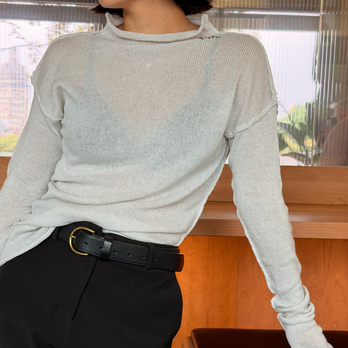 Givéh Panda mock-neck sweater in ivory, a wool and cashmere knit by female artisans in Iran with an inside-out finish and embroidered Givéh lettering at the neckline