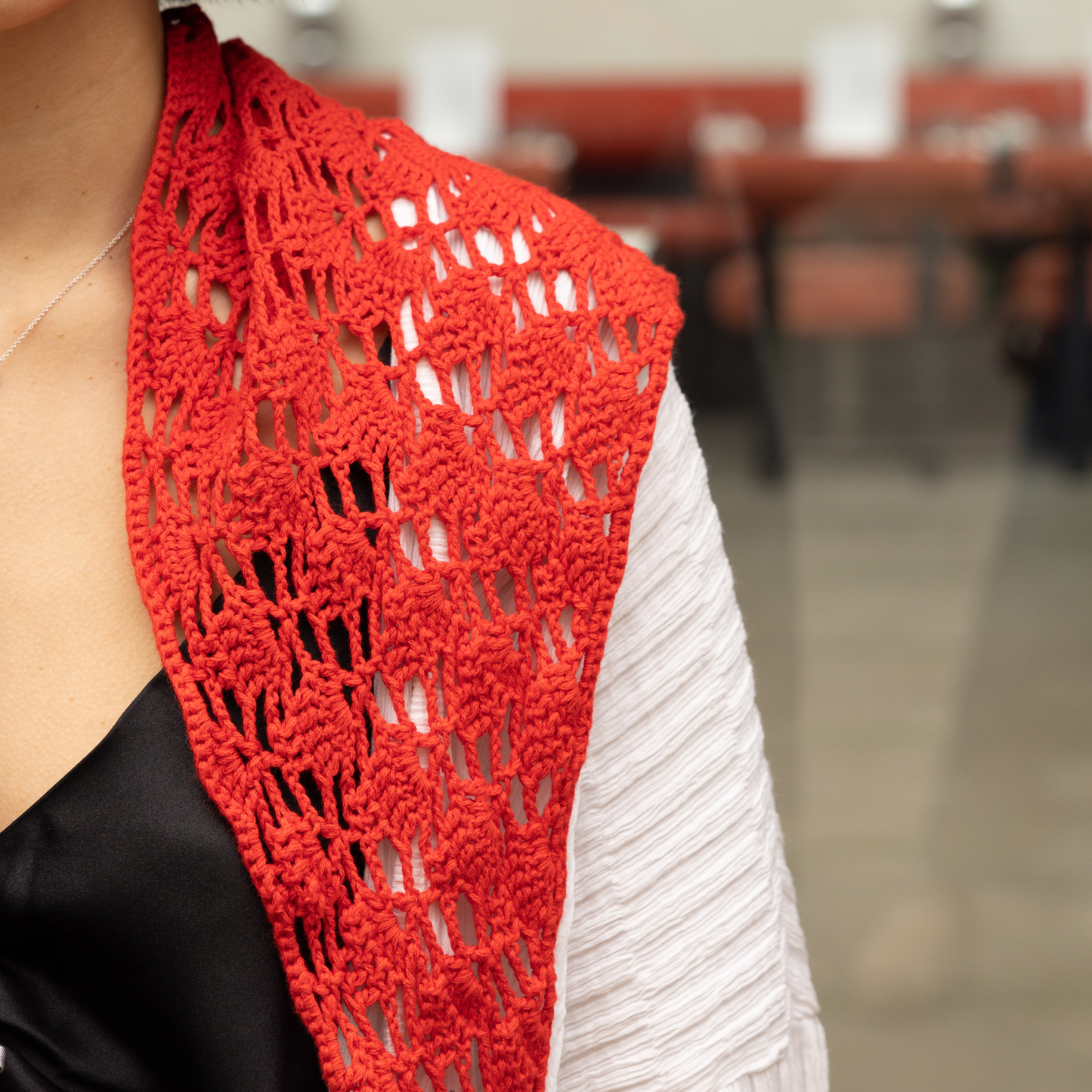 Givéh knitwear red cotton hand crocheted mini scarf by female artisans in Iran, openwork crochet wrap styled at the waist