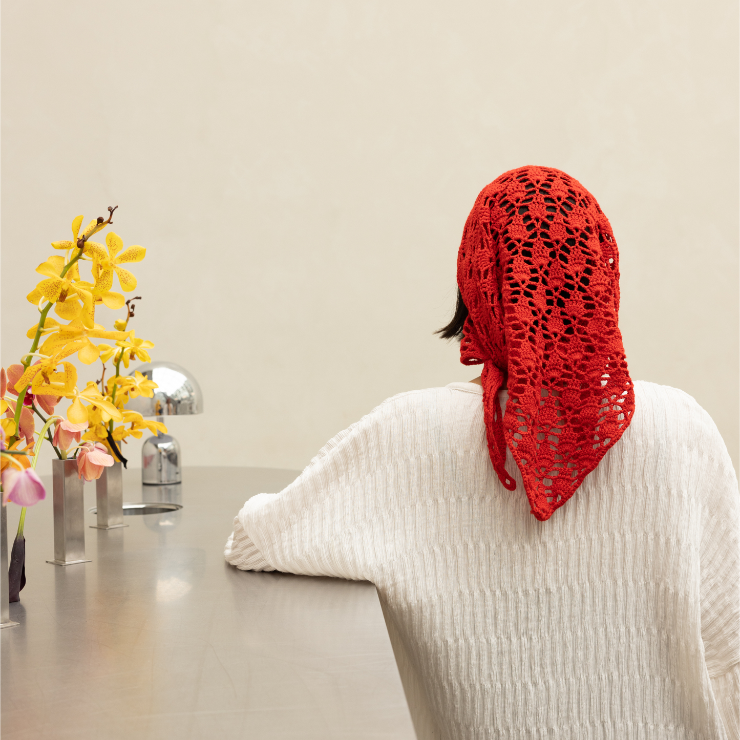 Givéh knitwear red cotton hand crocheted mini scarf by female artisans in Iran, openwork crochet wrap styled at the waist