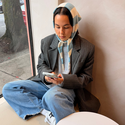 Givéh handmade merino wool cashmere-blend mini scarf by female artisans in Iran, hand embroidered lily detail in a blue stripe