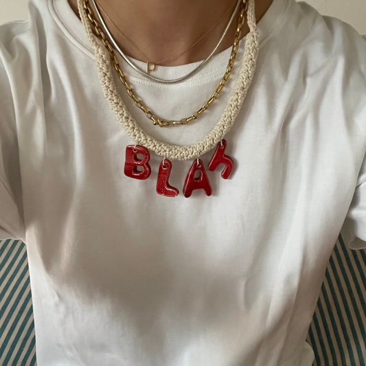 givéh knitwear handmade by female artisans in iran. blah hand crocheted undyed cotton necklace with handmade clay ceramic pendant.