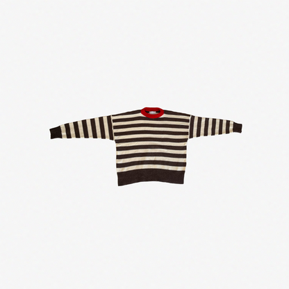 Striped sweater with a red collar on a white background.
givéh knitwear handmade by female artisans in iran using only natural and recycled fibres. contemporary knitwear for cool people. brown and cream striped unisex sweater with red crew neckline. 100% merino wool. fall 2025 collection.