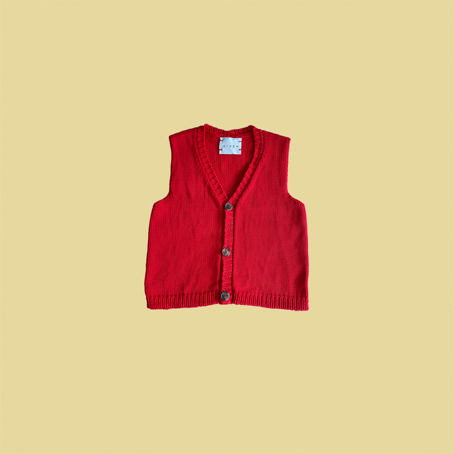 givéh knitwear handmade by female artisans in iran using only natural and recycled fibres. contemporary knitwear for cool people. red vesty vest, red knit vest with three natural horn buttons, made of cotton and recycled polyamide yarn, handcrocheted edges. spring summer 2025 collection.